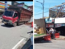 Sebuah mobil terpuruk ditengah jalan dalam kota Tungkal,Diduga Akibat Jalan Berlubang Tanpa Di Pasang  Rambu